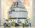 The CST-100 Starliner spacecraft to be flown on Boeing’s Orbital Flight Test (OFT) is viewed Nov. 2, 2019, while undergoing launch preparations inside the Commercial Crew and Cargo Processing Facility at Kennedy Space Center in Florida. During the OFT mission, the uncrewed Starliner spacecraft will fly to the International Space Station for NASA’s Commercial Crew Program.